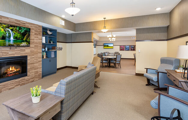 inside view of arbor building with seating areas and television