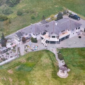 aerial view of big house and property